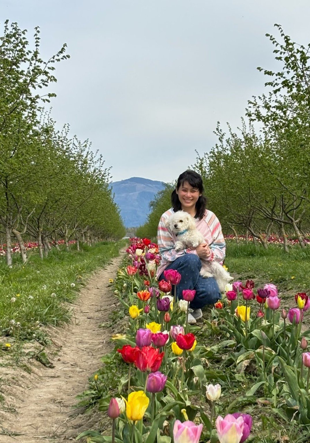 Me and a dog among the tulips